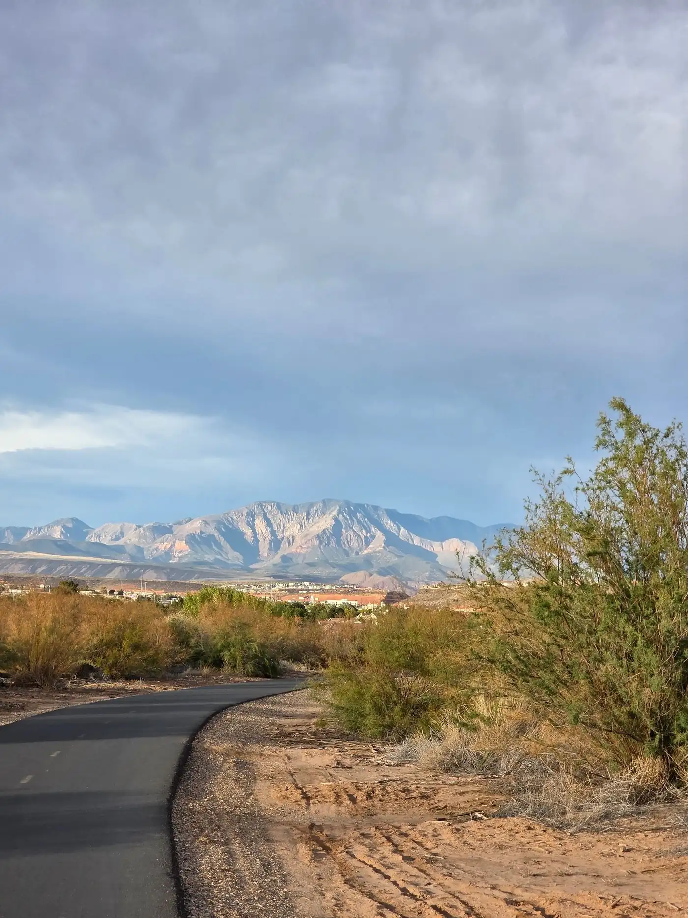 Open Nevada desert valley with snow-dusted mountains on the horizon