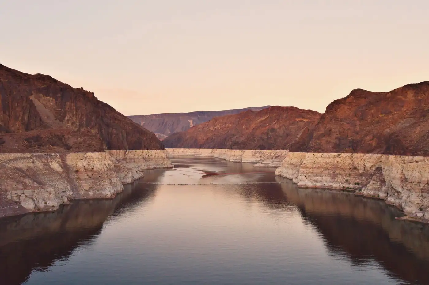 Lake Mead at sunset with rugged canyon walls near Boulder City
