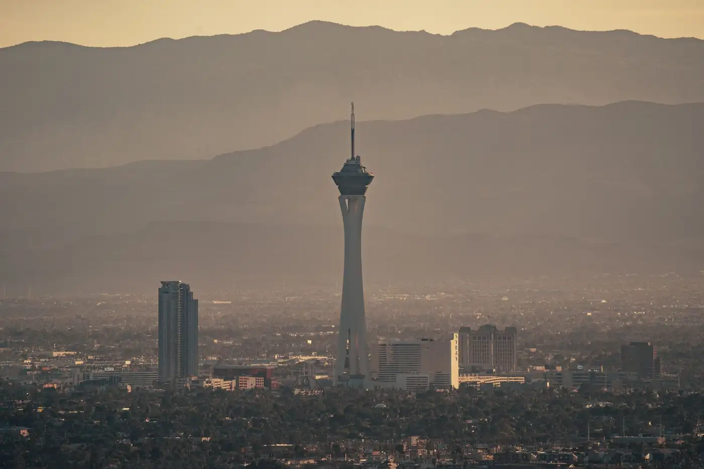 Las Vegas skyline with the Strat tower and mountains in the haze